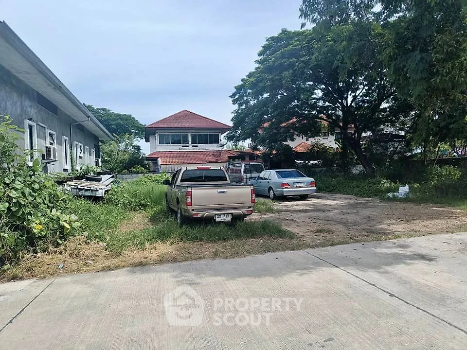 Spacious residential property with ample parking and lush greenery