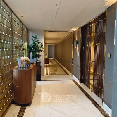 Luxurious hallway with elegant decor and marble flooring in upscale building