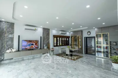 Spacious modern living room with marble flooring and elegant dining area