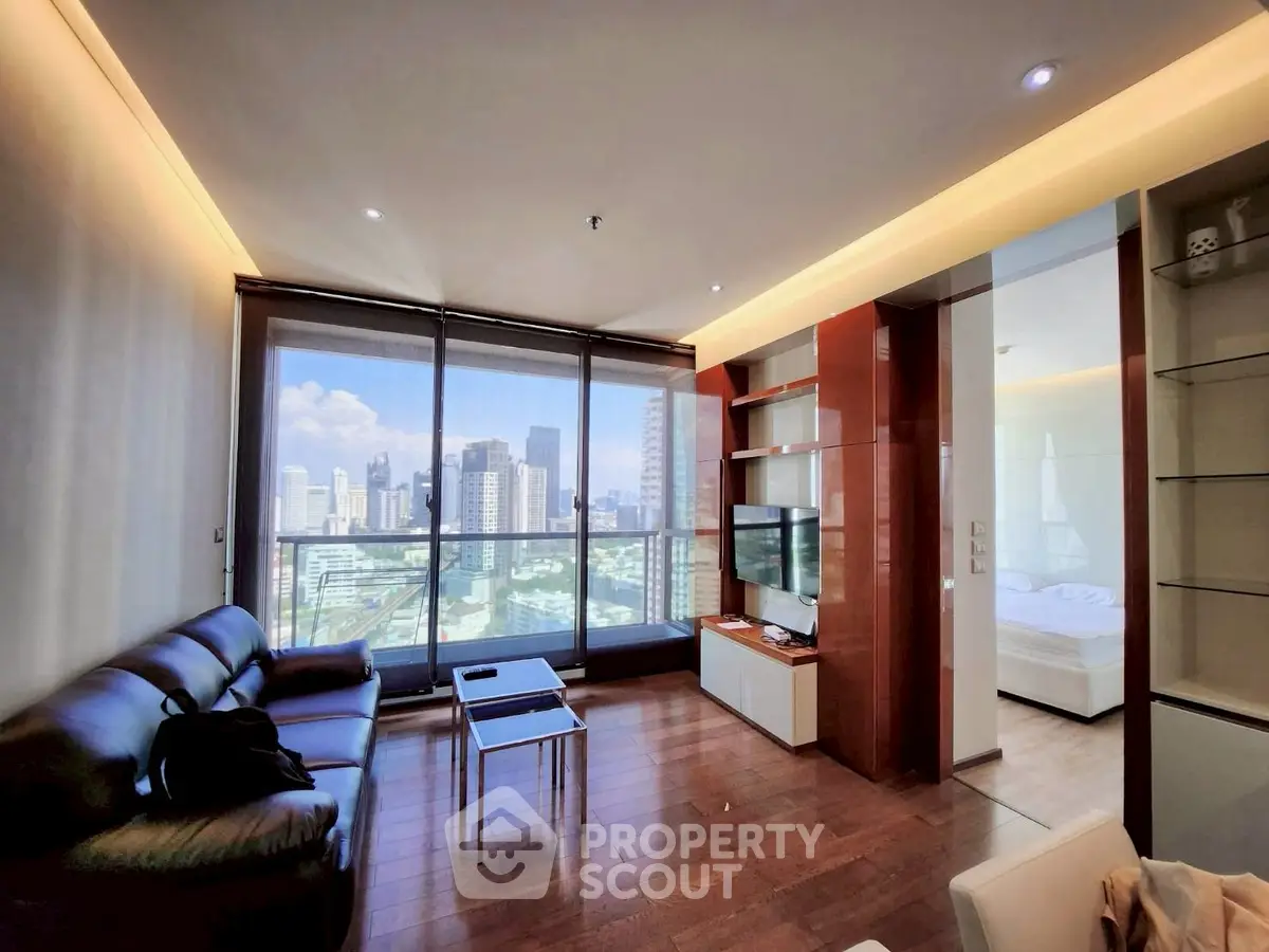 Luxurious city-view living room with modern furnishings and floor-to-ceiling windows