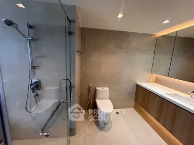 Luxurious modern bathroom with glass shower and elegant vanity