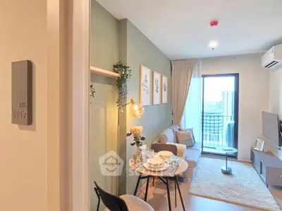 Modern living room with cozy decor and balcony view in a stylish apartment.
