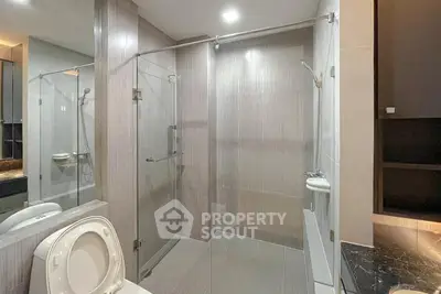 Modern bathroom with glass shower enclosure and sleek design