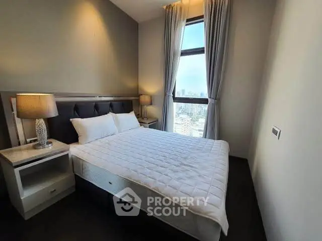 Modern bedroom with city view and elegant decor