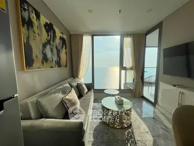 Luxurious living room with stunning ocean view and elegant decor