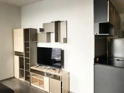 Modern living room with sleek TV unit and stylish shelving