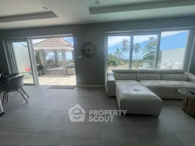 Luxurious living room with ocean view and modern furniture in tropical villa
