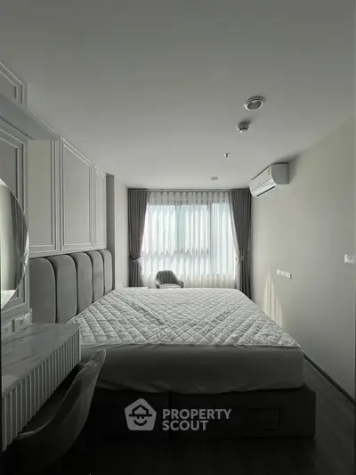 Modern bedroom with elegant decor and natural light