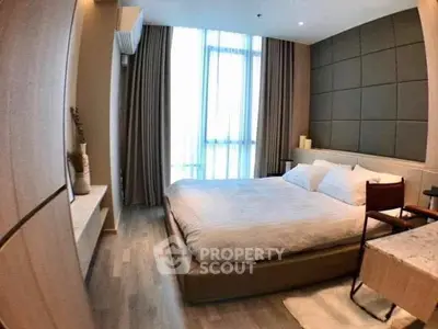Luxurious modern bedroom with elegant decor and large window