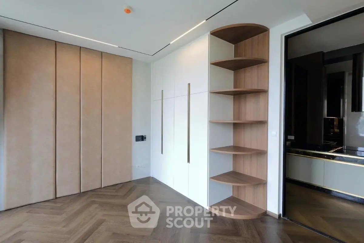 Modern interior with stylish shelving and parquet flooring in a contemporary apartment.