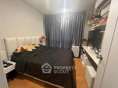 Cozy bedroom with modern decor and ample natural light