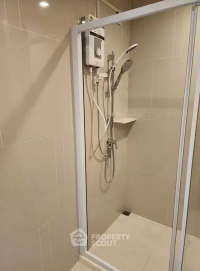 Modern bathroom shower with sleek design and neutral tiles