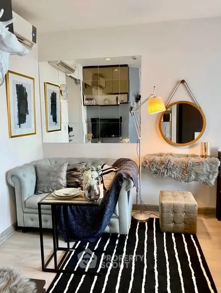 Stylish living room with modern decor, cozy sofa, and elegant lighting in a chic apartment.