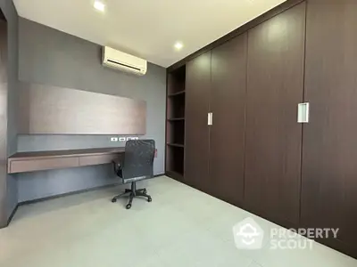 Modern study room with built-in desk and ample storage space