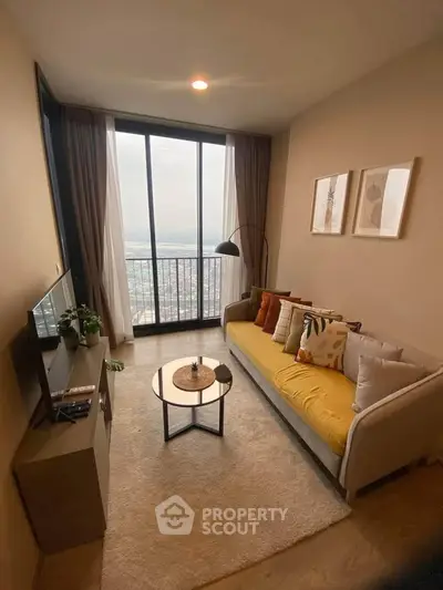 Cozy living room with large window and stylish decor in modern apartment