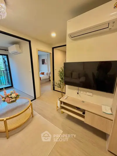 Modern living room with air conditioning and stylish decor in a cozy apartment.