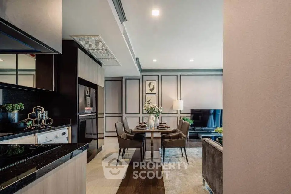 Modern open-plan living and dining area with stylish decor and elegant furnishings.