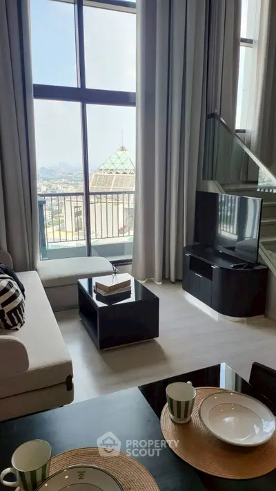 Luxurious living room with floor-to-ceiling windows and stunning city view