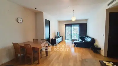 Spacious living room with wooden flooring and modern furniture