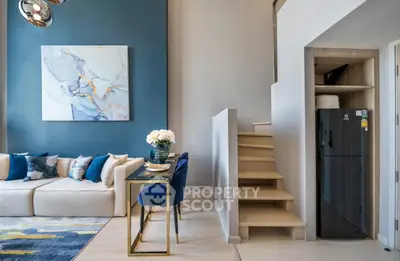 Modern duplex living room with stylish decor and staircase