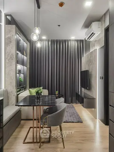 Modern living room with elegant decor, featuring sleek furniture and ambient lighting for a cozy atmosphere.