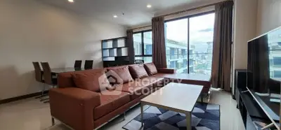 Spacious modern living room with city view and stylish furniture