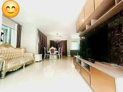 Luxurious living room with elegant furniture and chandelier, perfect for sophisticated living.