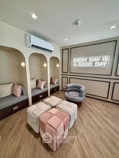 Chic modern living room with cozy seating and stylish decor, featuring a motivational neon sign.