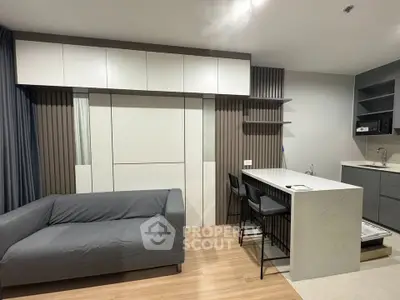 Modern living room with sleek design and open kitchen layout