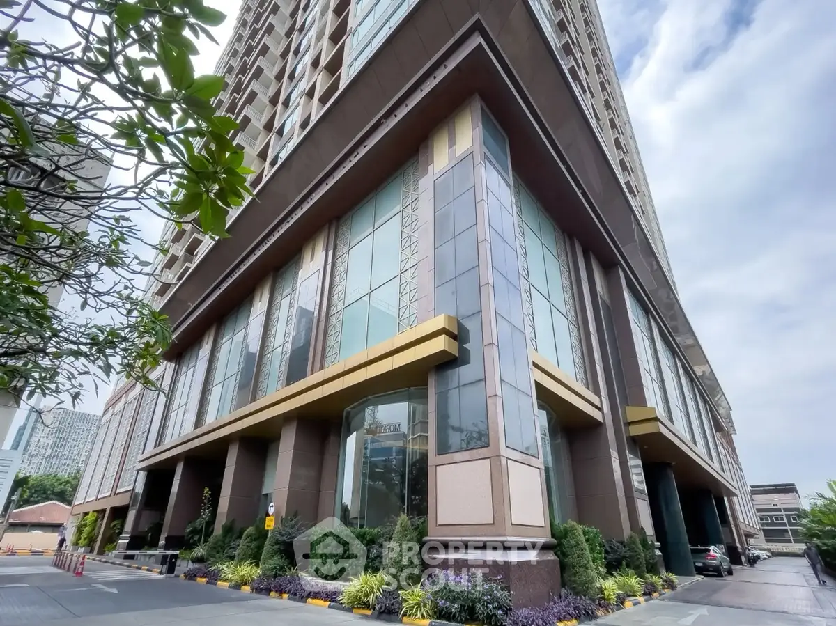 Stunning modern building exterior with lush landscaping and impressive architectural design.