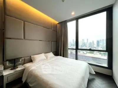 Luxurious bedroom with stunning city view and modern decor