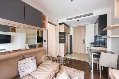 Modern open-plan living room with sleek kitchen and stylish decor