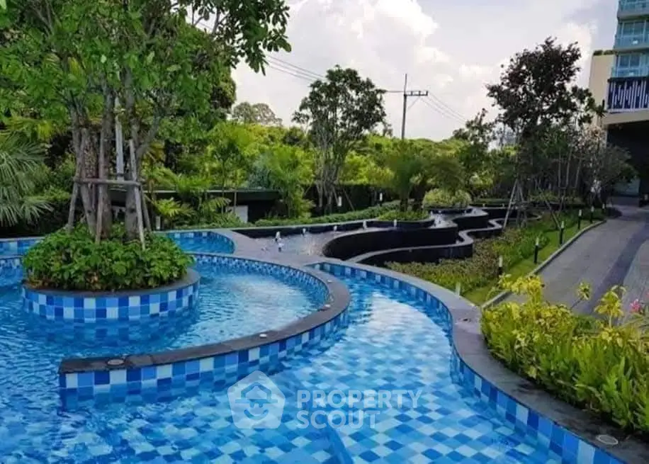 Luxurious outdoor pool with lush greenery and modern design