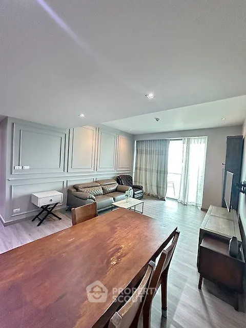 Spacious living room with modern decor and natural light