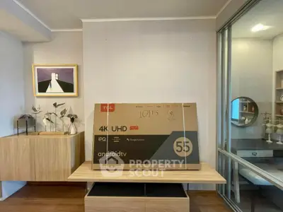 Modern living room with stylish decor and a new 55-inch 4K UHD Android TV box.