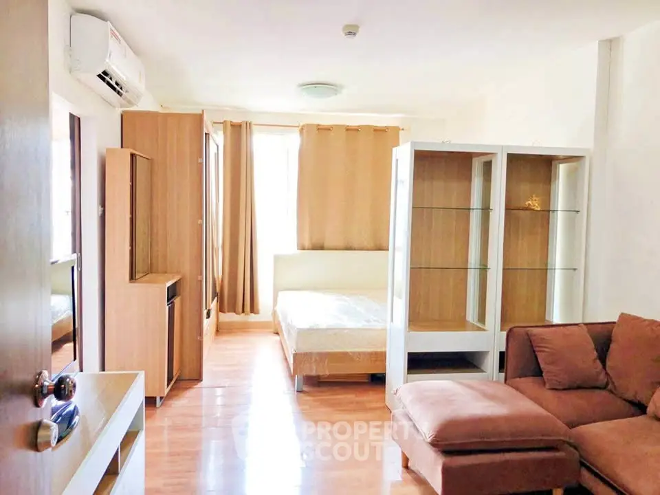 Spacious studio apartment with modern furnishings and natural light