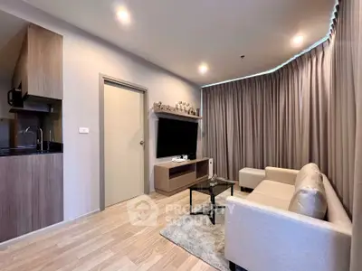 Modern living room with cozy beige sofa and sleek TV setup in stylish apartment.