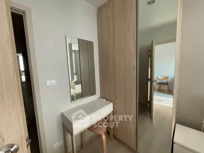 Modern bedroom with sleek wooden wardrobe and minimalist vanity desk