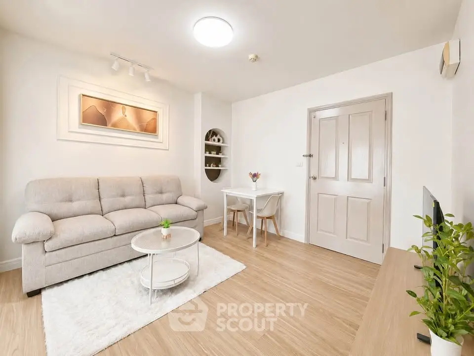 Bright and cozy living room with modern decor and wooden flooring