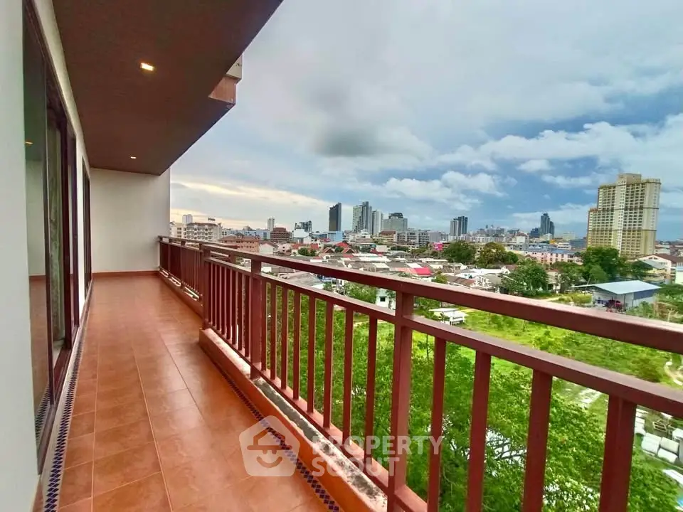 Spacious balcony with stunning city view in high-rise apartment