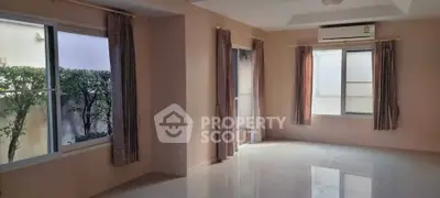 Spacious corner unit living room with large windows and garden view, perfect for natural light lovers.