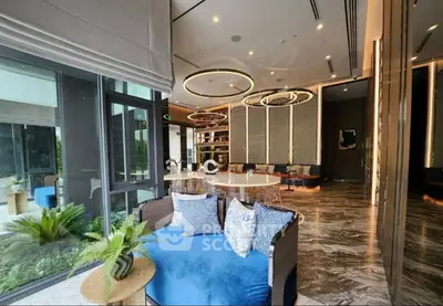 Luxurious modern living room with elegant decor and large windows offering garden views.