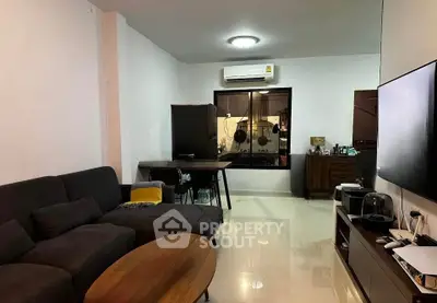 Cozy living room with modern furniture and open kitchen layout