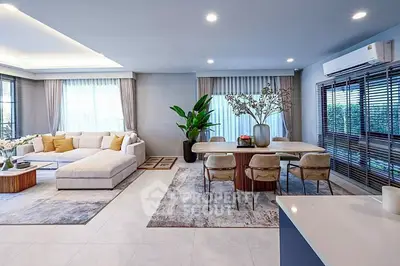 Spacious modern living room with elegant dining area and large windows