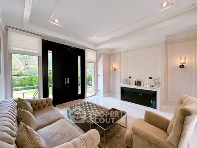 Luxurious living room with elegant furniture and garden view