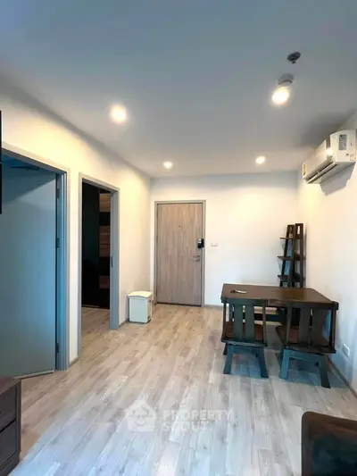 Modern apartment interior with wooden flooring and minimalist furniture