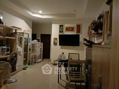 Spacious living room with modern decor and ample storage space, perfect for comfortable living.
