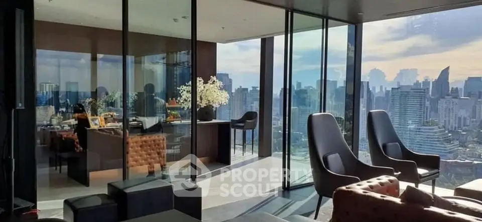 Luxurious high-rise living room with panoramic city views and modern furnishings.