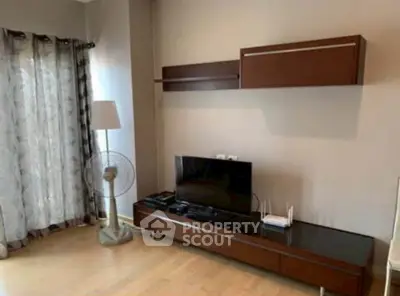 Modern living room with sleek TV unit and stylish shelving, perfect for contemporary living.