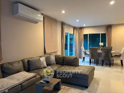 Spacious modern living room with elegant dining area and stylish decor